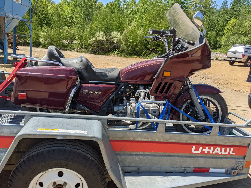 With help from 2 burly workers, loaded her up for the ride out of town.