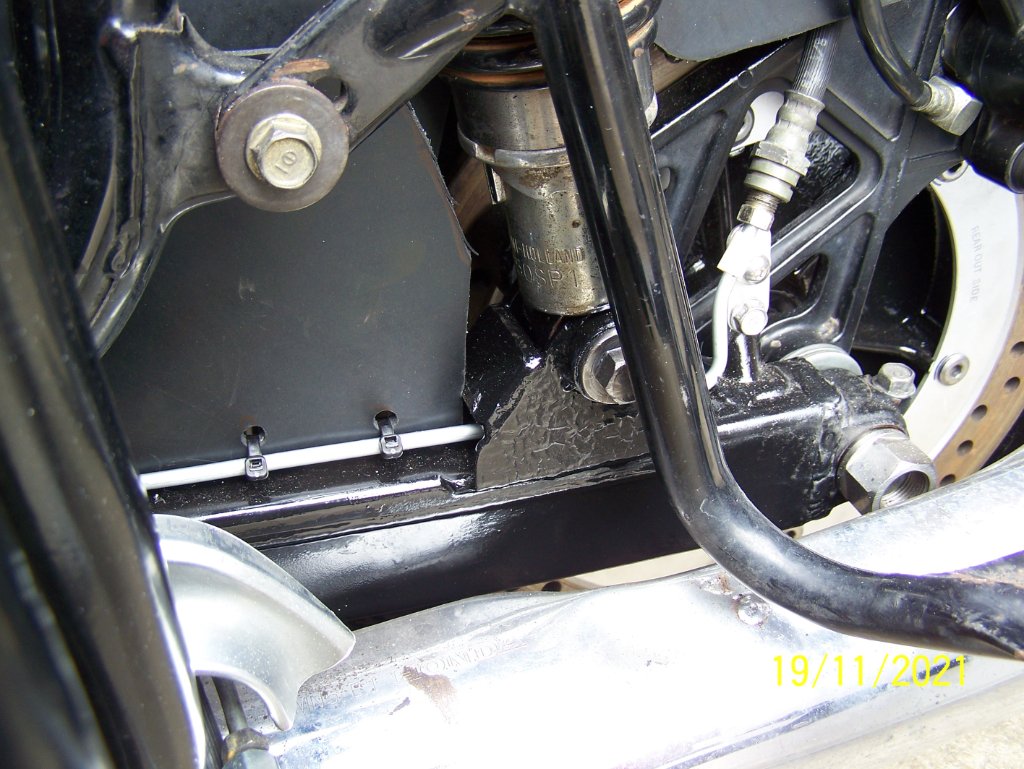 Bottom left shockie mount with brake line running through.