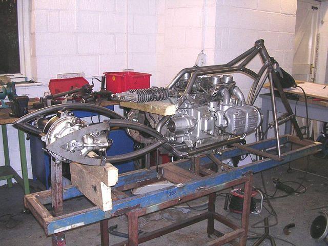 The rear wheel was turned down to just the cush drive ... a new bearing support tube was made and the rear disc relocated ... co