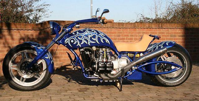 Light tan leather seat and white oak hand grips to accent all that deep blue