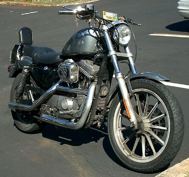 Here she is after $500 worth of parts and paint.  She runs good and sounds awesome, but that Sportster shakes the crap out of me