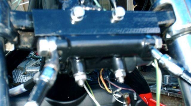 I had to use a piece of angle iron to mount the front brakeline splitter at a 90 degree angle so I could mount it under the Harl