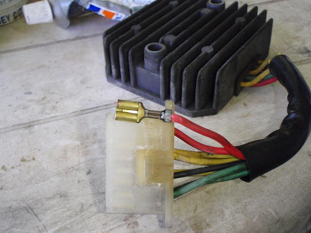  Removing contacts from regulator-rectifier plug to solder, pretty corroded around the crimp