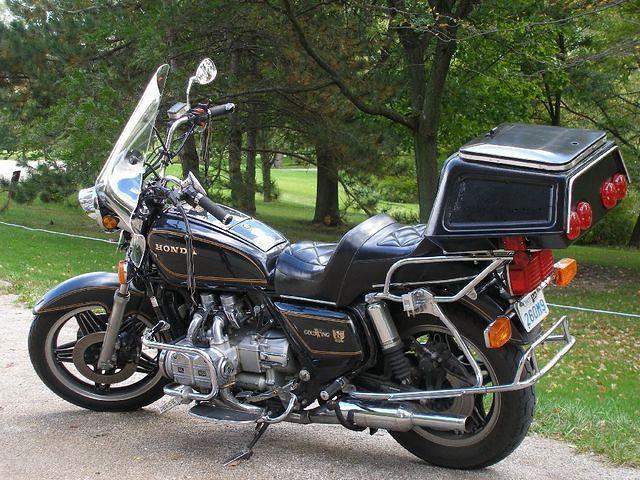 The large chrome railing surrounding the back tire holds the removable Hondaline luggage. 