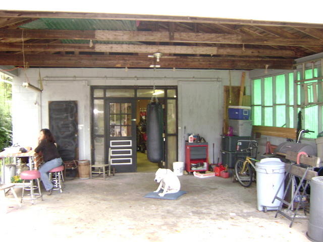 OUT IN FRONT OF THE SHOP