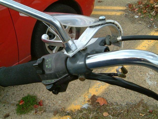 The shields are simply mounted under the mirrors.  I used 1/8" aluminum bar for the mount and drilled a hole for the mirror