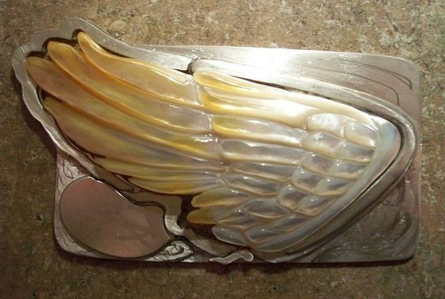 PIECING A METAL PUZZEL TOGETHER