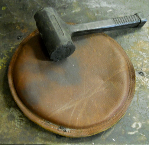 Beat the panels to death on this leather sand pad but not with that hammer!