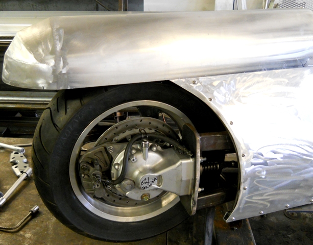 FIRST LOOK OF BIKE UNHOOKED FROM THE JIG WITH A REAR TIRE MOUNTED-PLENTY OF CLEARANCE FROM THE SWINGARM FENDER AND PANELS