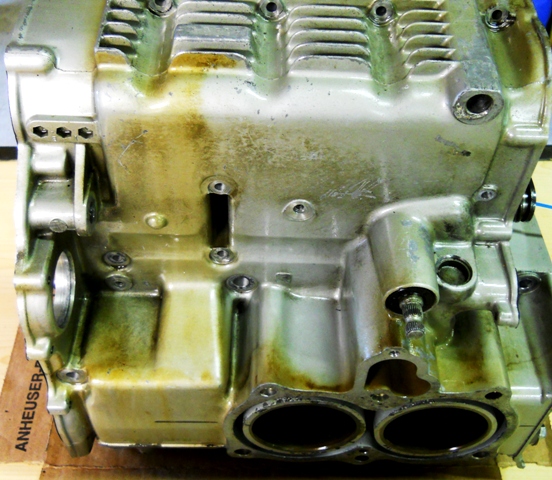 IS THERE A COLUMBO OUT THERE THAT CAN TELL US WHAT THEY THINK THE LARGE DARK STAIN IS RUNNING DOWN THE LEFT SIDE OF THE MOTOR