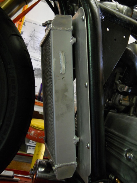 RADIATOR OUT FRONT ON CROSS PLATE WITH HOLE IN IT