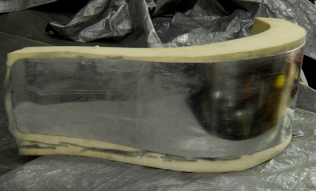 RUBBER GLUED TO TIN