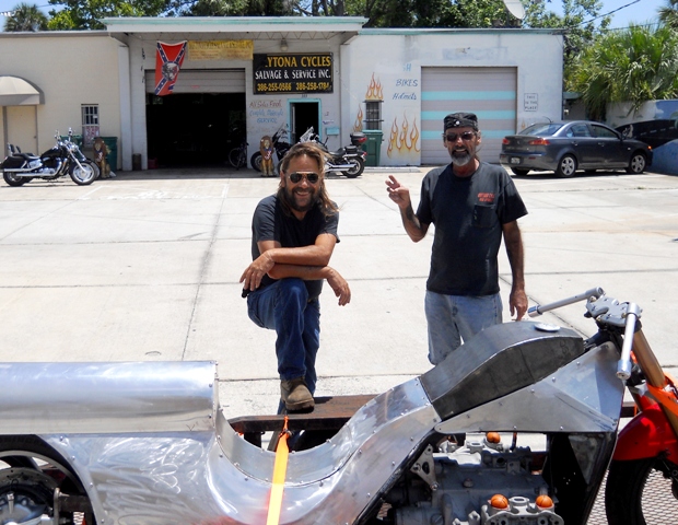 THE BOYS OF DAYTONA CYCLE WATCHING BIKE CRASHES IN STREET BEHIND ME AS I TOOK THE PHOTO!