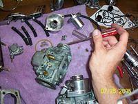 remove pilot air on side of carb. be careful not to lose the spring. 