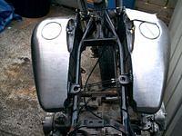 This is what a seven gallon flatside fat bob tank looks like on a wing frame, way too wide!