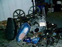 This is what started my most recent obsession, a 1978 Yamaha XS750.  I started it before I tore it down to this pile.
