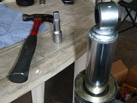 Used small hammer, half-inch extension, and back-up plate B to tap new seal in place
