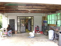 OUT IN FRONT OF THE SHOP