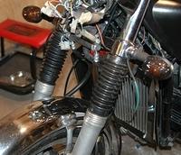 fork gaiters from a cb750. We'll see how well they work. I like the way they look. When I mount the fork brace, she'll have a st