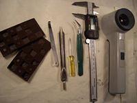 Some tools I've found usefull.
Wedges
A feeler-gauge heated and bend
for adjusting float level
A pair of dividers to remove 