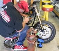 WINSTON AND HIS HACK SAW!   CUTTING OFF RADIATOR MOUNTING BOLTS